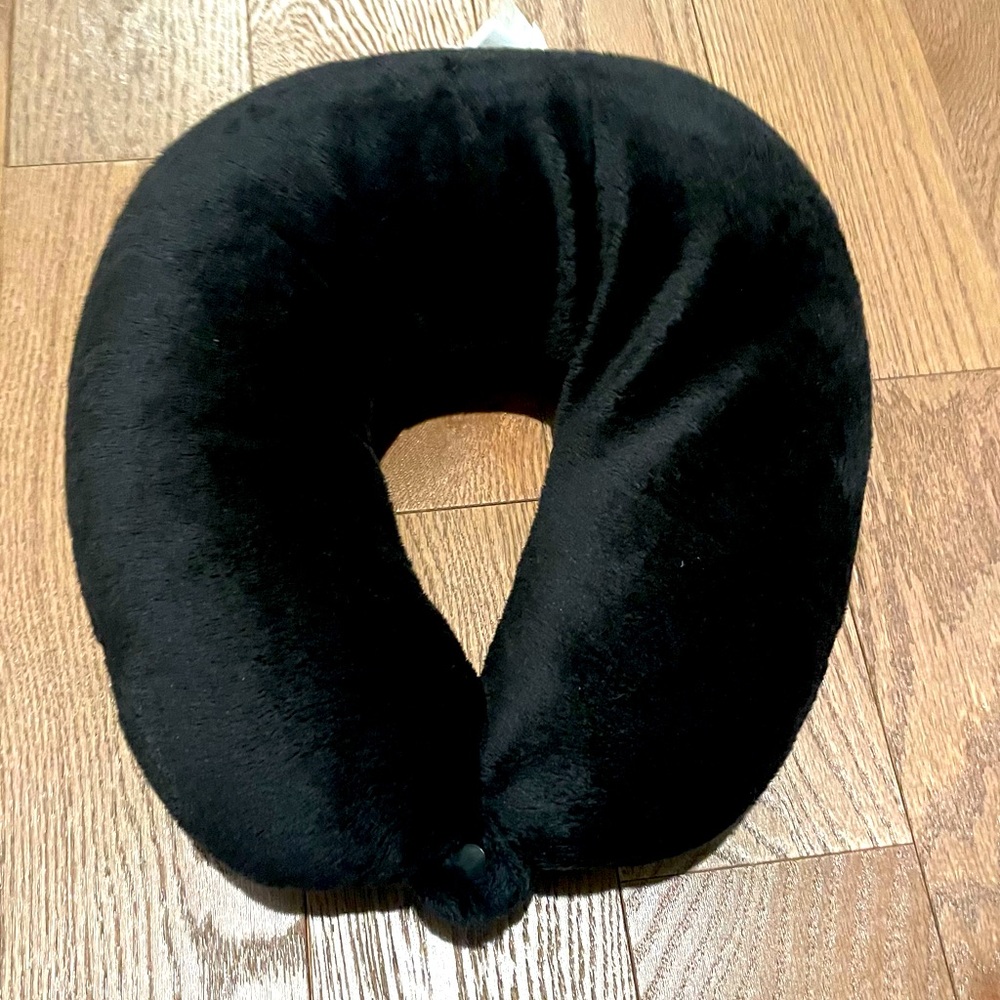Black Travel neck pillow with snap.
